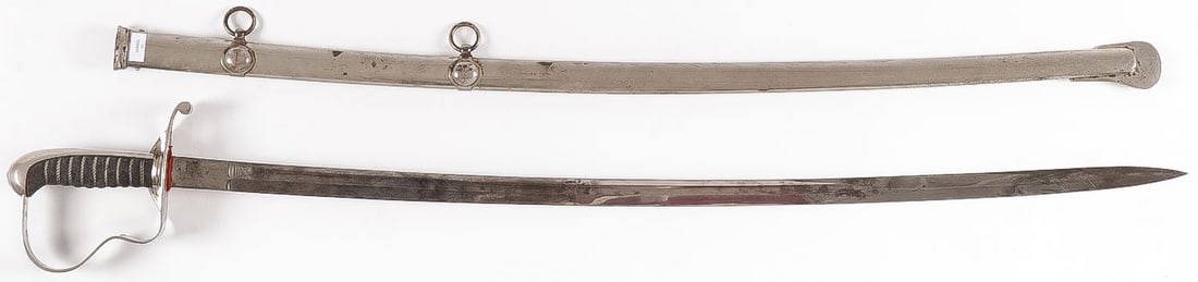 GERMAN BADEN M1856 INFANTRY OFFICER'S SWORD: GERMAN BADEN M1856 INFANTRY OFFICER'S SWORD. A rare officer's sword, 1856 pattern. Nickel-plated, single-edged blade with a double-edged point and fullers. The blade is decorated with etching. Nickel-