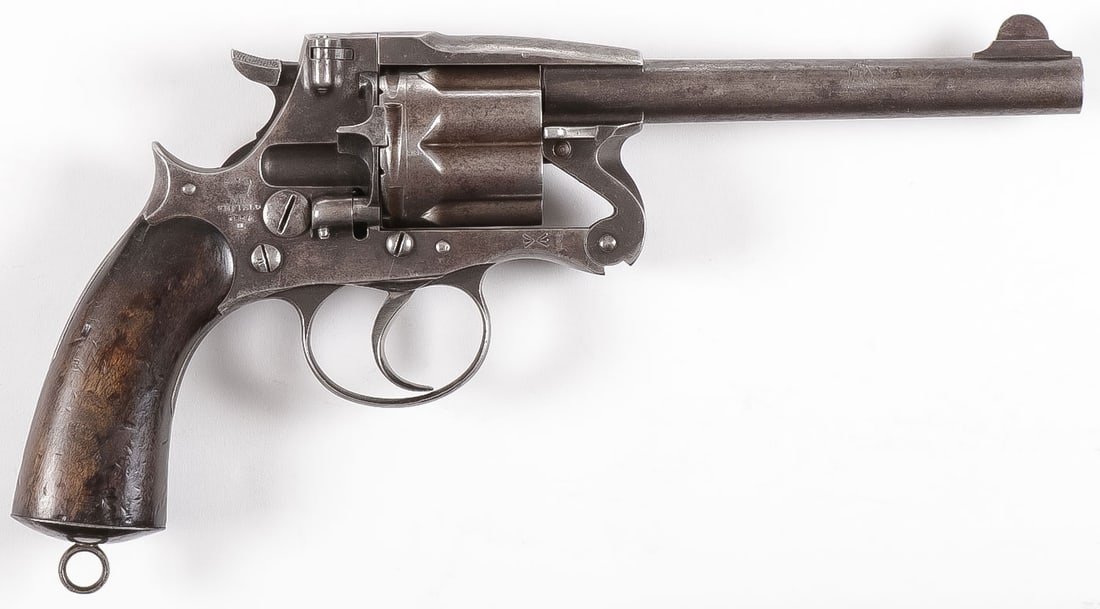 BRITISH ENFIELD REVOLVER DATED 1884: BRITISH ENFIELD REVOLVER DATED 1884. Double action breakfront, .476 caliber, walnut grips, marked on the right side of the frame with a crown over "V.R./ENFIELD/1884/II", with a lanyard ring on the bo