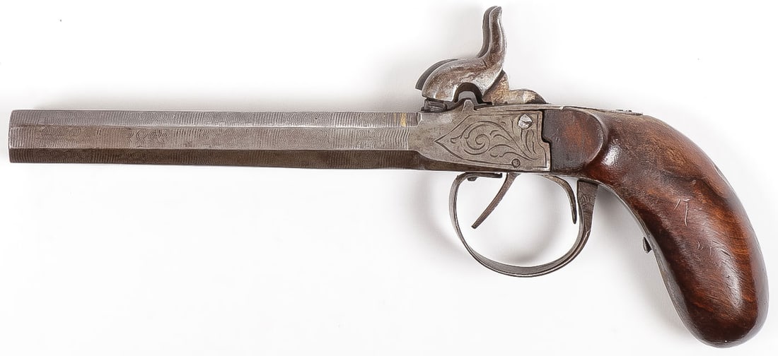 GERMAN DOUBLE BARREL PERCUSSION PISTOL: GERMAN DOUBLE BARREL PERCUSSION PISTOL. Approximate .45 cal., with 5.5 inch double Damascus octagonal barrels, double triggers and walnut bag handle grip. Overall length 10 inches.
