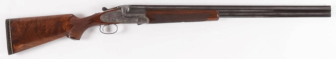 FANCY ENGRAVED H. BARELLA OVER UNDER SHOTGUN: FANCY ENGRAVED H. BARELLA OVER UNDER SHOTGUN. Comprising a fine custom crafted H. Barella Berlin over under .20 ga. shotgun with 27-inch barrels. Fancy walnut stock with finely checkered forend and gr