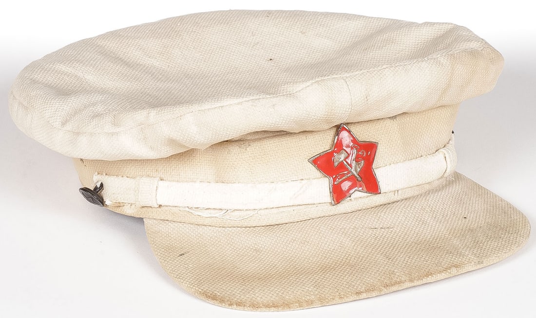 SCARCE EARLY RED ARMY SUMMER CAP. C 1920: SCARCE EARLY RED ARMY SUMMER CAP. C 1920. Comprising a scarce early summer cap of the Red Army command staff. Made of light white canvas like material with large painted metal red star, and black side