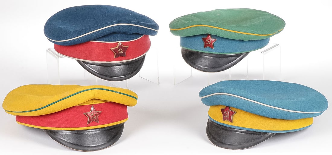 4 EARLY OR EARLY STYLE SOVIET RED ARMY CAVALRY: 4 EARLY OR EARLY STYLE SOVIET RED ARMY CAVALRY VISOR CAPS. Each of piped and banded cloth bodies of varying colors designating units and each with enameled red star above visor, two examples with stam