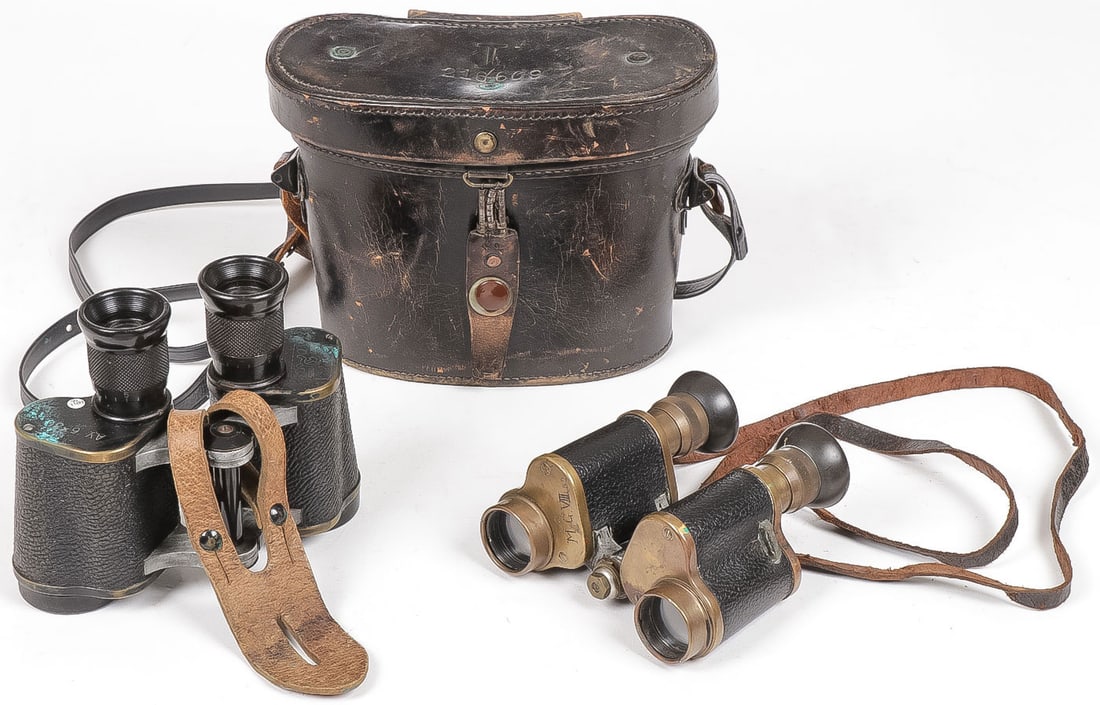 PAIR OF GERMAN & RUSSIAN MILITARY BINOCULARS: PAIR OF GERMAN & RUSSIAN MILITARY BINOCULARS. Comprising a pair of cased 1935 dated Russian field binoculars and a pair of German binoculars engraved M.G. VII 32 makers mark of Goerz, Berlin. Leather 