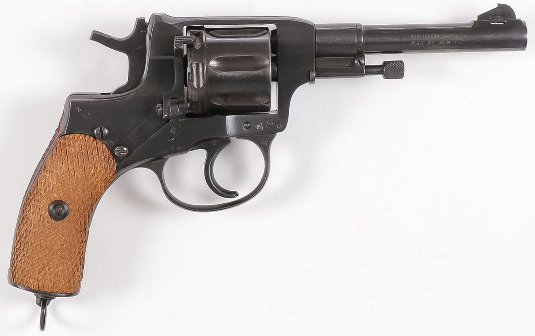 WWII RUSSIAN IZHEVSK M1895 NAGANT REVOLVER: WWII RUSSIAN IZHEVSK M1895 NAGANT REVOLVER. 1944 dated WWII Russian Izhevsk Model 1895 in 7.62mm caliber double action Nagant pistol, 4.5 inch barrel. Blued finish. Checkered wood grips. Fixed sight.