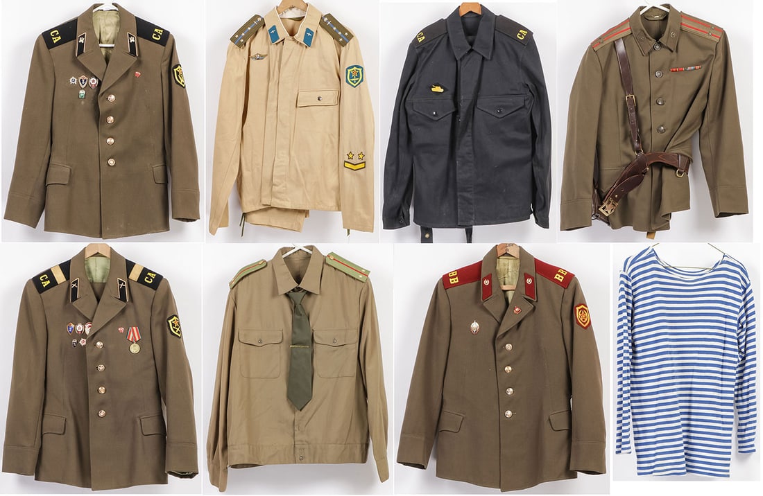 7 RUSSIAN SOVIET UNIFORMS: 7 RUSSIAN SOVIET UNIFORMS. Comprising seven individual uniform coats, shirts, pants, various branches as shown, including two officer uniforms, and a blue and white Navy shirt. Greatest overall measur