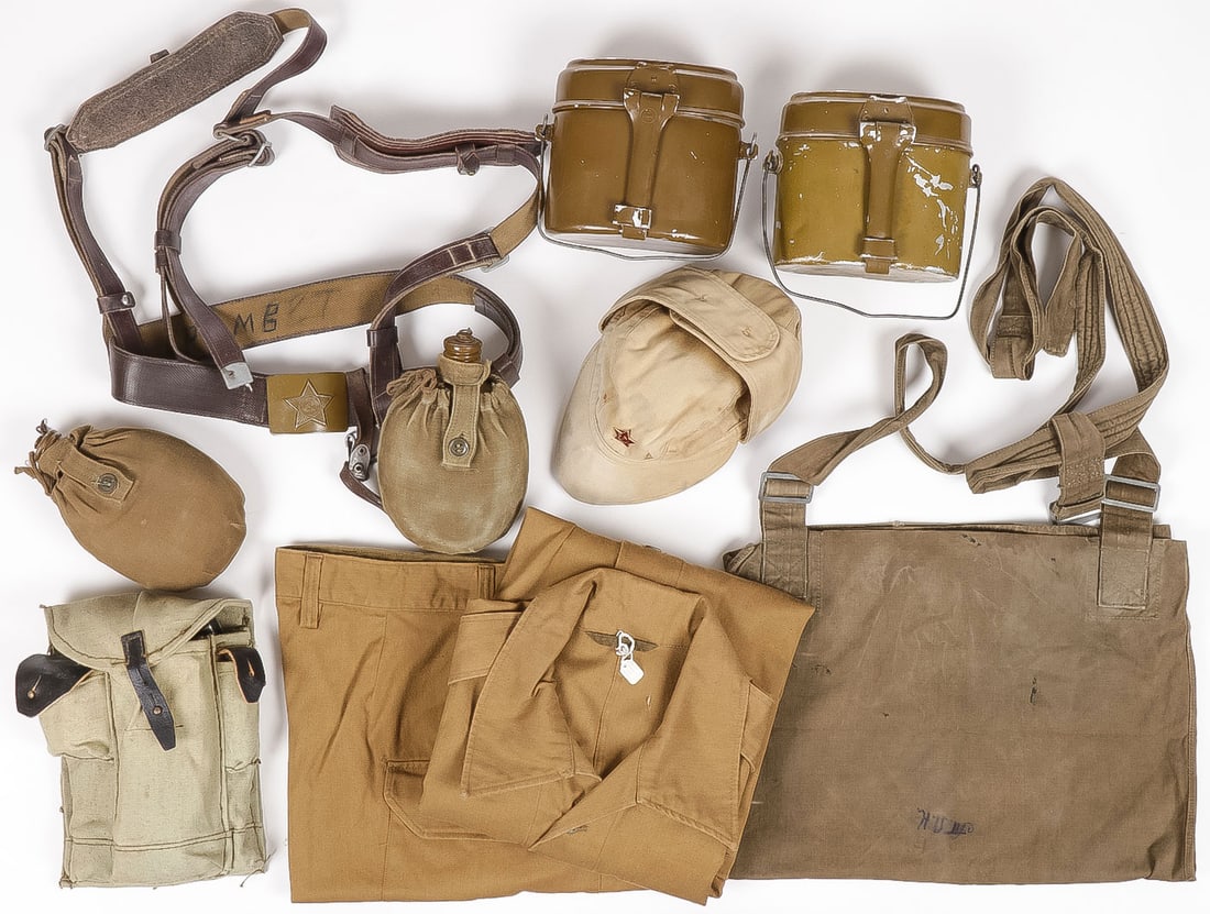 GROUP OF RUSSIAN SOVIET GEAR & CLOTHING: GROUP OF RUSSIAN SOVIET GEAR & CLOTHING. Comprising 13 individual pieces as shown, including two mess kits, a solo canteen, a canteen on belt with shoulder harness, a magazine pouch, summer visor cap,