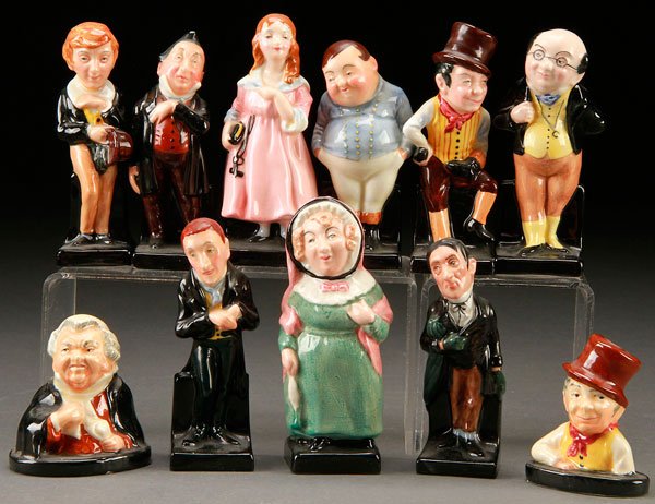 11 ROYAL DOULTON FIGURES AND PAPERWEIGHTS: AN 11 PIECE GROUP OF ROYAL DOULTON FIGURES AND PAPERWEIGHTS. Comprising "David Copperfield", "Pecksniff", "Little Nell", "Fat Boy", "Pickwick", "Sam Weller", "Uriah Heep", "Mrs. Bardell", "Stiggins", 