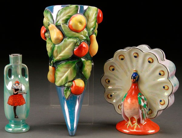 3 PIECES NORITAKE ART DECO PORCELAIN: A THREE PIECE HAND PAINTED NORITAKE ART DECO PORCELAIN GROUP, EARLY 20TH CENTURY. Comprising a handled perfume bottle with harlequin figure (stopper absent), a blue luster wall pocket with blown out f