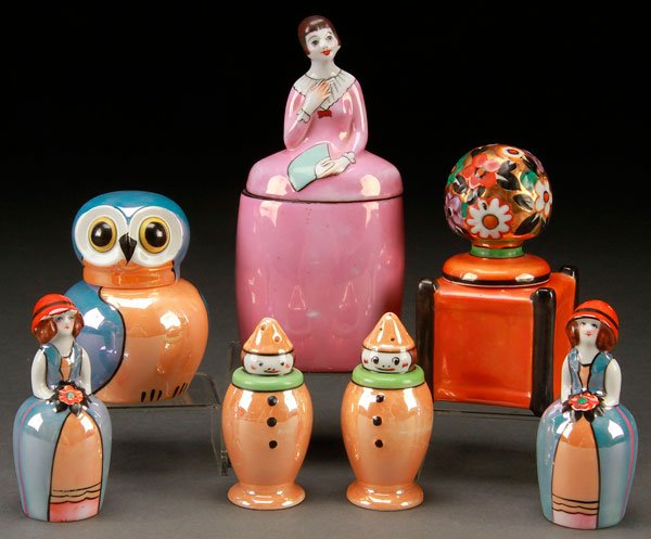 NORITAKE ART DECO PORCELAIN FIGURAL GROUP: A VERY FINE HAND PAINTED NORITAKE ART DECO PORCELAIN FIGURAL GROUP, EARLY 20TH CENTURY. Comprising a lidded dresser box of a woman with fan, a figural owl and floral basket inkwells, and two figural p