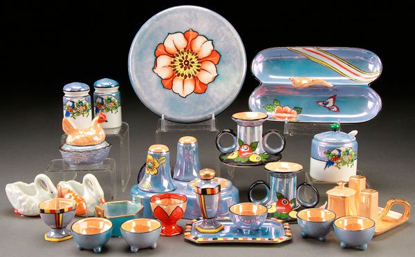 20 PIECES NORITAKE ART DECO PORCELAIN: A 20 PIECE HAND PAINTED NORITAKE ART DECO PORCELAIN GROUP, EARLY 20TH CENTURY. Comprising assorted table accessories with floral decoration, including a bird handled nappy, partial condiment set, cand
