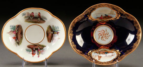 A PAIR OF 19TH CENTURY MEISSEN CABINET BOWLS: A PAIR OF 19TH CENTURY MEISSEN CABINET BOWLS. Of oval quatrefoil form. The largest with hand painted romantic seascape scenes within scrolled gilt cartouches. The other with countryside settings of fi