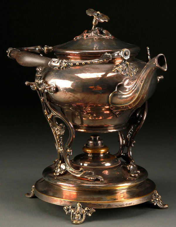 A FRENCH CHRISTOFLE SILVERED HOT WATER SERVER: A FRENCH "CHRISTOFLE" SILVERED HOT WATER SERVER, LATE 19TH CENTURY. Of tilting form with sculpted floral decoration. Height 14.5 inches (37 cm).