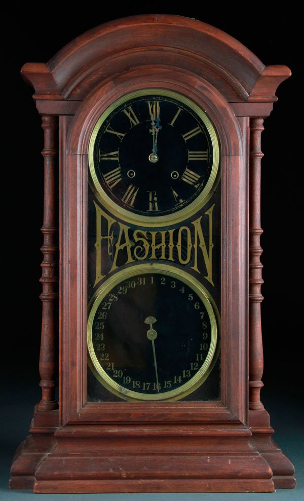 A VICTORIAN REGULATOR SHELF CLOCK: A VICTORIAN REGULATOR SHELF CLOCK. With calendar dial and "Fashion" reverse painted glass front. Probably by New Haven. Height 28 inches (71 cm).