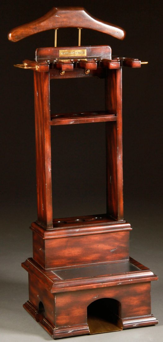 MAITLAND-SMITH MAHOGANY GOLFER'S VALET: A "MAITLAND-SMITH" MAHOGANY GOLFER'S VALET AND PUTTING STATION. With ball return, club holders and jacket rack. Height 39 inches (99 cm).