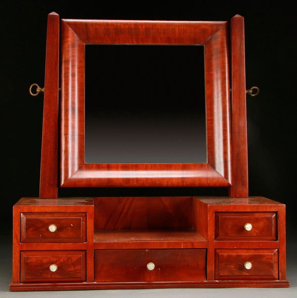 EMPIRE STYLE MAHOGANY DRESSER TOP SHAVING STAND: AN EMPIRE STYLE MAHOGANY DRESSER TOP SHAVING STAND, 20TH CENTURY. With five drawers and burl wood veneer fronts. Height 24.5 inches (62 cm), width 23.75 inches (60.5 cm), depth 8.5 inches (21.5 cm).