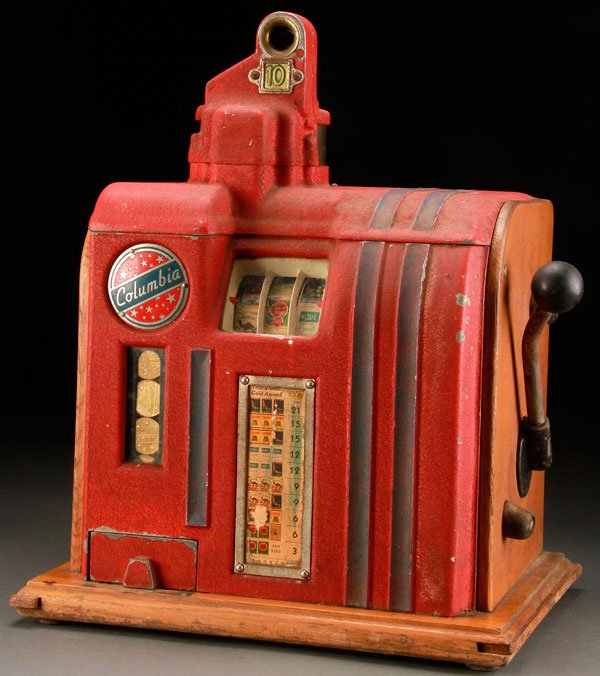VINTAGE SLOT MACHINE TRADE STIMULATOR, CIRCA 1930S: A COLUMBIA TEN CENT TRADE STIMULATOR, CIRCA 1930S. With cigarette reels and token payout. Height 19 inches (48.25 cm).