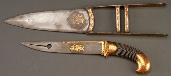 AN INDIAN KATAR AND GOLD NIELLOED DAGGER: AN INDIAN KATAR AND GOLD NIELLOED DAGGER. The katar with gold nielloed Islamic cartouche and the handle with gold nielloed decoration of scrolling foliage, length 15.6 inches (39.5 cm). The dagger bl