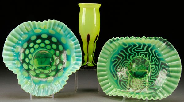 A THREE PIECE ART GLASS GROUP, EARLY 20TH CENTURY: A THREE PIECE ART GLASS GROUP, EARLY 20TH CENTURY. Comprising a Loetz Art Deco tango vase and two green opalescent bowls. Height of vase 8.25 inches (21 cm), diameter of largest bowl 9.75 inches (25 c