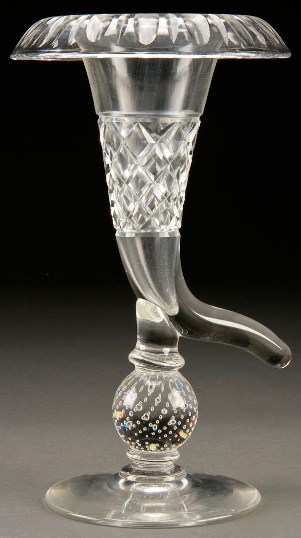 A CUT GLASS CORNUCOPIA FORMED VASE: A CUT GLASS CORNUCOPIA FORMED VASE, EARLY 20TH CENTURY. With everted rim raised on a controlled bubble paperweight vase, probably by Pairpoint. Height 12.25 inches (31.1 cm).