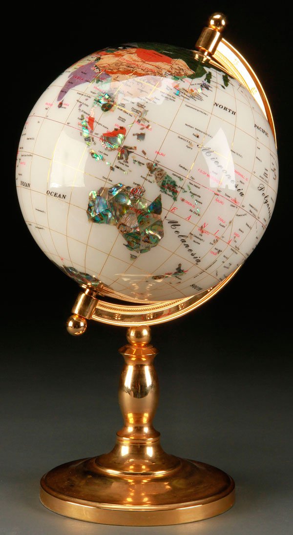 A GEMSTONE SPECIMEN GLOBE, LATE 20TH CENTURY: A GEMSTONE SPECIMEN GLOBE, LATE 20TH CENTURY. Finely inlaid with over 20 semi-precious stones and displayed on a gilt bronze stand. Height 17.5 inches (42 cm).