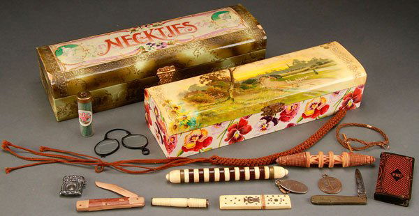 VICTORIAN DRESSER BOX AND DECORATIVE CARVING: A VICTORIAN DRESSER BOX AND DECORATIVE CARVING GROUP, 19TH/20TH CENTURY. Comprising two celluloid necktie dresser boxes, carved ivory needle cases, a carved Bakelite match case, a carved wooden jack k