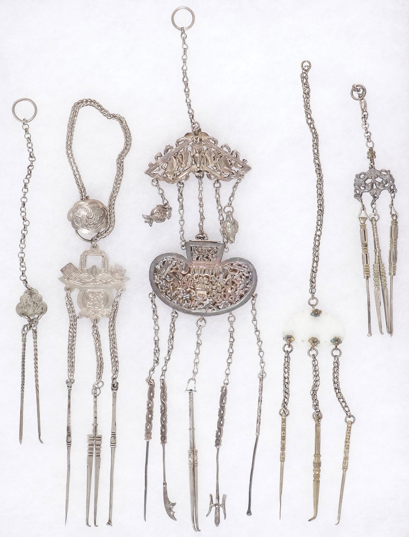 5 CHINESE GROOMING CHATELAINES, QING: 5 CHINESE GROOMING CHATELAINES, QING. Comprising a good group of five Chinese grooming chatelaines, including one very ornate and finely crafted example with pierced pendants, each with various utensi
