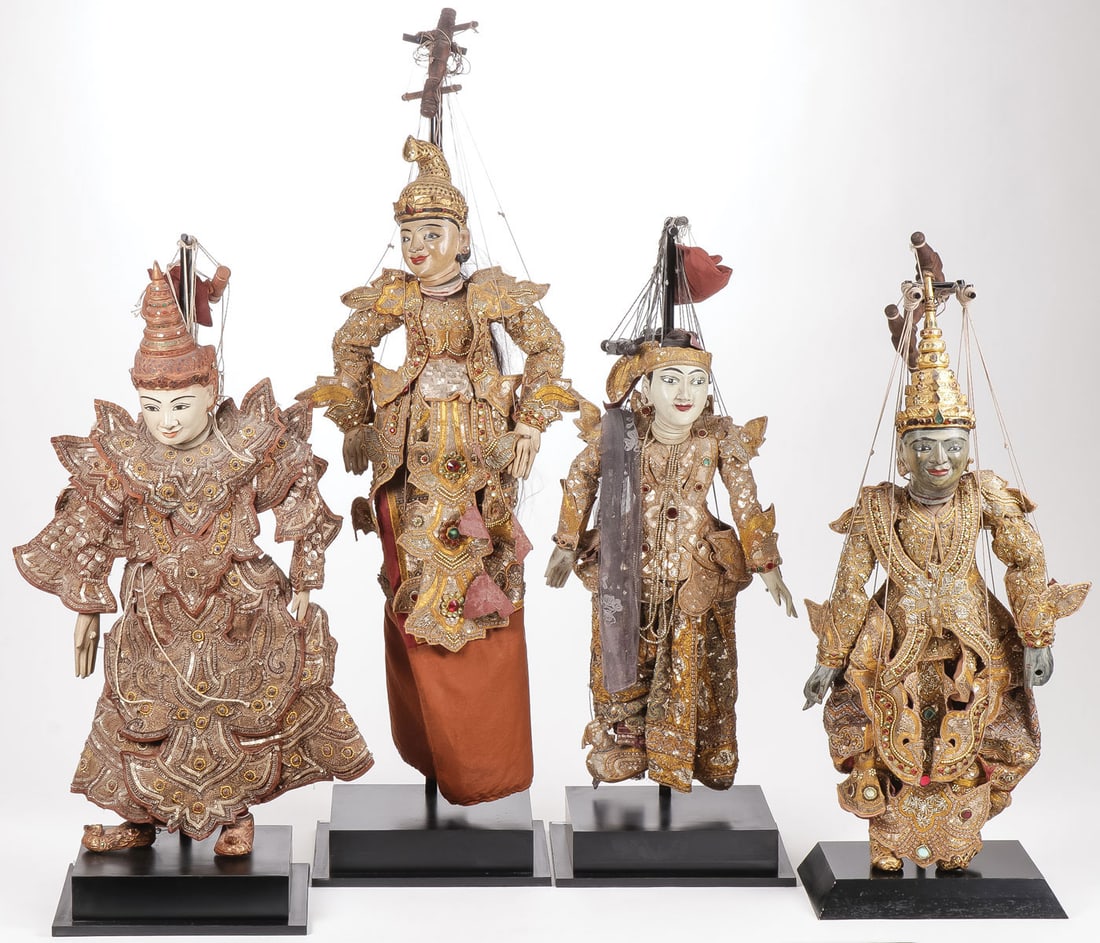 GROUP OF FOUR BURMESE MARIONETTES, 19TH/20TH C: GROUP OF FOUR BURMESE MARIONETTES, 19TH/20TH C. Each carved in wood and gesso, with painted features and elaborate stitched gowns adorned with sequined beading and jewelry, mounted on custom museum-qu