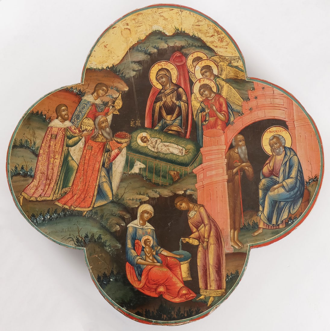 FINE & UNIQUE RUSSIAN ICON OF THE NATIVITY: FINE & UNIQUE RUSSIAN ICON OF THE NATIVITY, C. 1800. Comprising a unique and finely painted icon of the Nativity of Christ executed on a large quatrefoil wood panel and stylistically conforming to ico