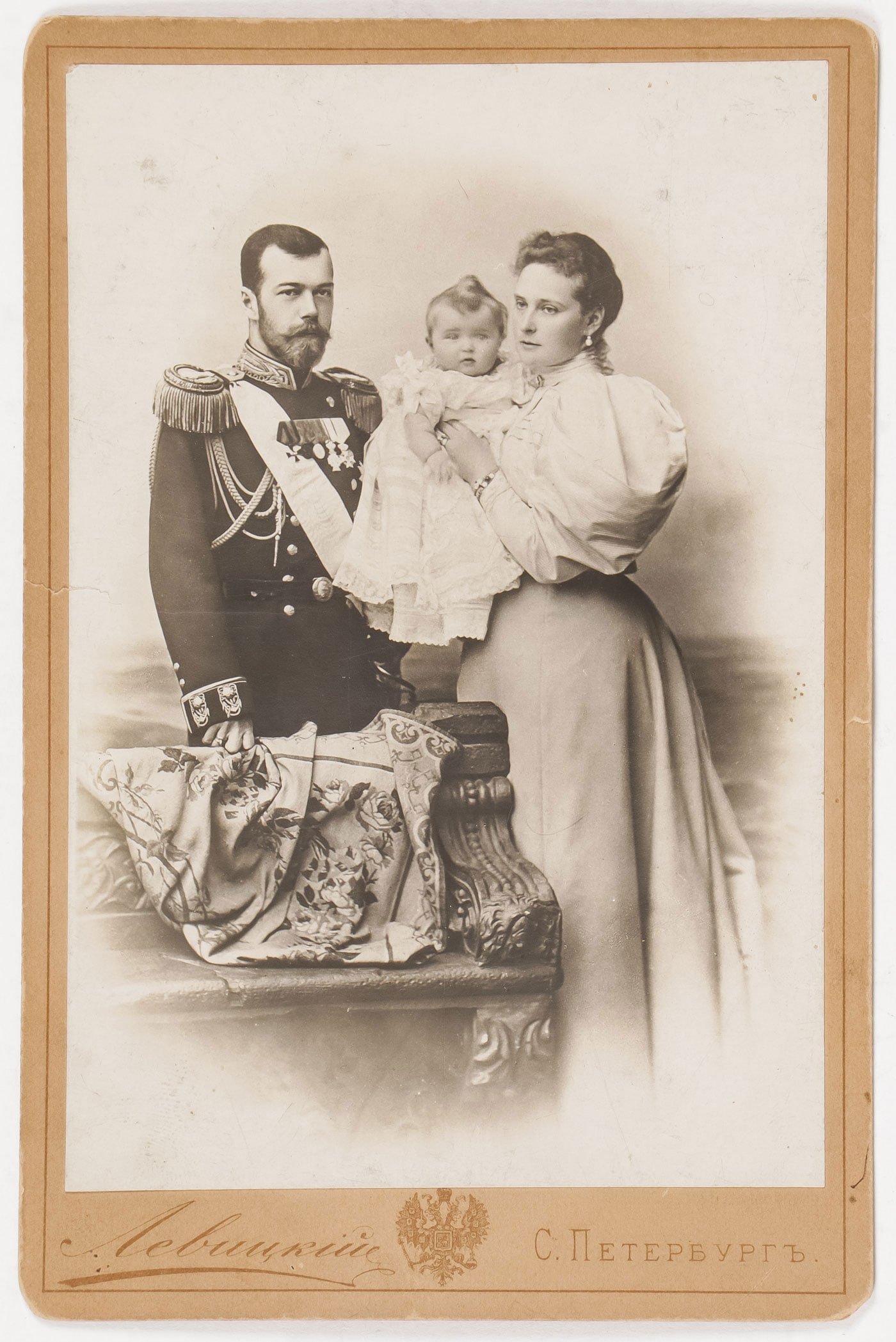 IMPERIAL RUSSIAN PHOTOGRAPH OF NICHOLAS II: IMPERIAL RUSSIAN PHOTOGRAPH OF NICHOLAS II & FAMILY. Comprising a good cabinet card photograph of Tsar Nicholas II with the Tsarina Alexandra Feodorovna and their first-born child Grand Duchess Olga, 