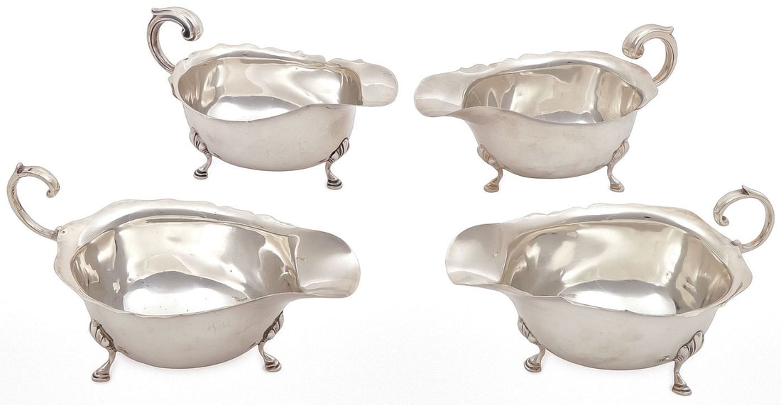 FOUR ENGLISH STERLING SILVER GRAVY BOATS: FOUR ENGLISH STERLING SILVER GRAVY BOATS. Comprising four sterling silver boats by Adie Brothers, Ltd., Birmingham, of similar but not identical design, with hallmarks. Each measuring 3.25 inches (hei