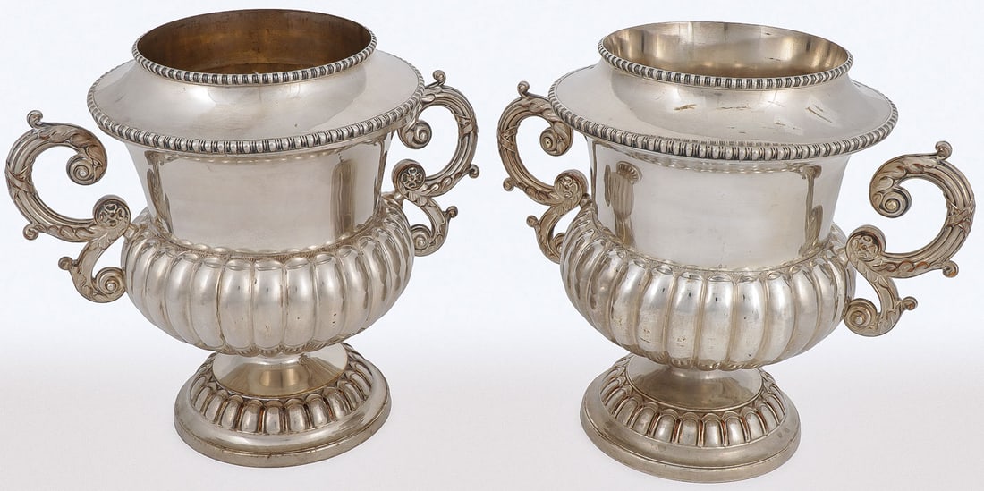 PAIR OF GEORGIAN SILVER-PLATED WINE COOLERS: PAIR OF GEORGIAN SILVER-PLATED WINE COOLERS. Comprising a pair of Georgian silver-plated wine coolers, of campagna form, with gadrooned bottom, reeded scroll handles, and removable liner and collar, o