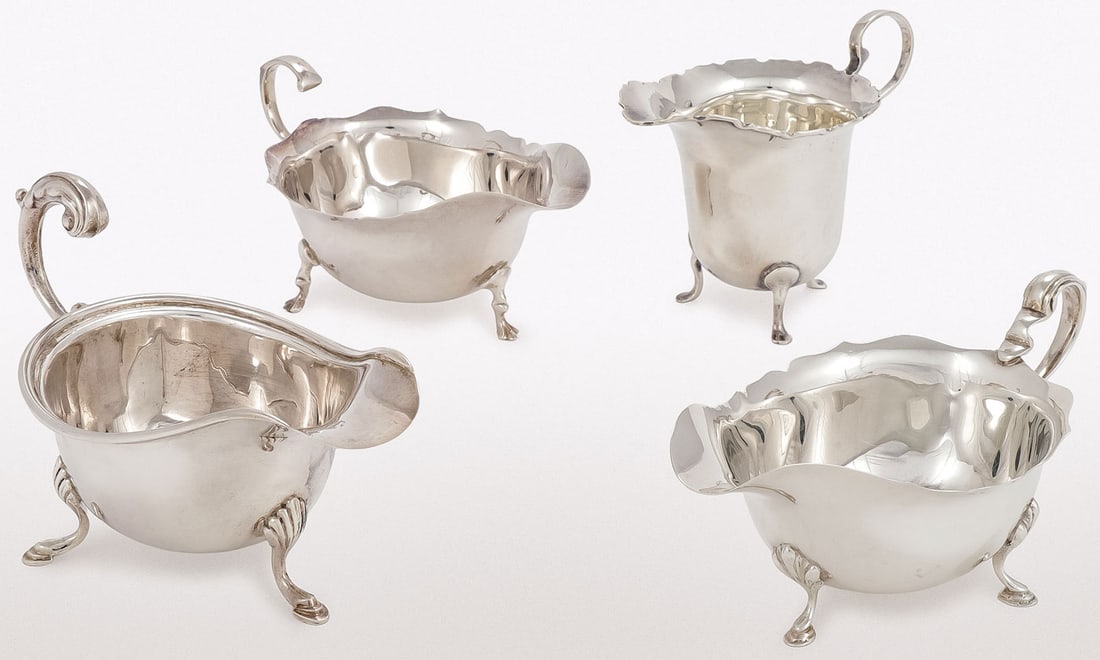 ENGLISH STERLING SILVER GRAVY BOATS AND CREAMER: ENGLISH STERLING SILVER GRAVY BOATS AND CREAMER. Comprising four individual items, each with hallmarks, including Birmingham city mark, including three gravy boats and a creamer. Greatest measurement 