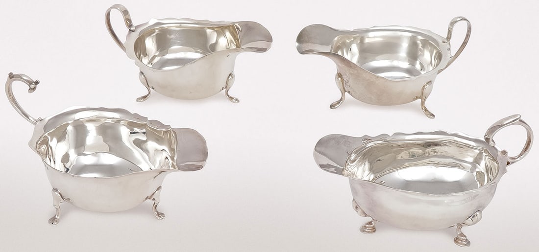 FOUR STERLING SILVER GRAVY BOATS: FOUR STERLING SILVER GRAVY BOATS. Of similar but not identical design as shown, including examples by Horace Woodward & Co. Ltd., Birmingham; W. H. Tandy & Sons, Birmingham; Barker Ellis Silver Co., B