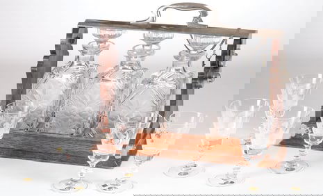 A STURDY OAK TANTALUS & GOBLETS, 19TH C