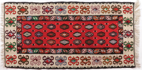 A GOOD KILIM WOVEN CARPET