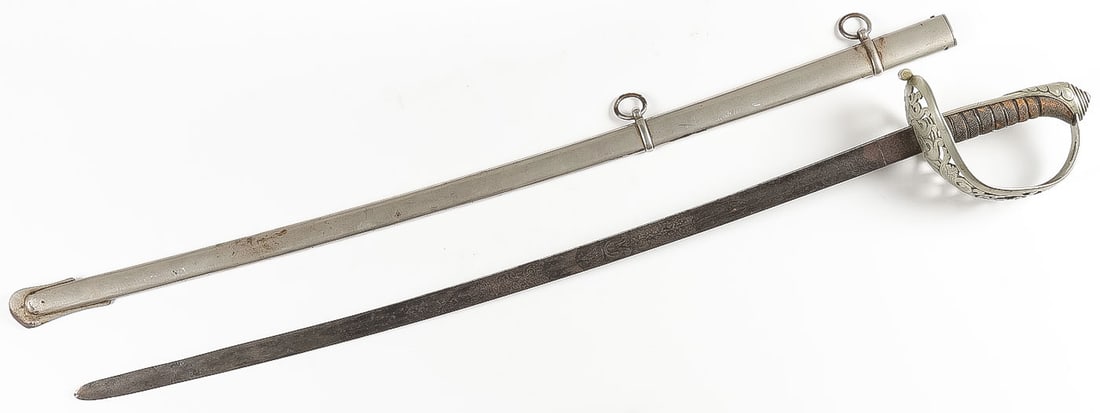 A PRUSSIAN ETCHED OFFICER'S SWORD: A PRUSSIAN ETCHED OFFICER'S SWORD. Pierced basket hilt with crowned cypher over V. Wire-wrapped fish-skin grip, grip frame engraved Hesse, maker's mark on ricasso F. Seeliger, and spine marked Eisenh