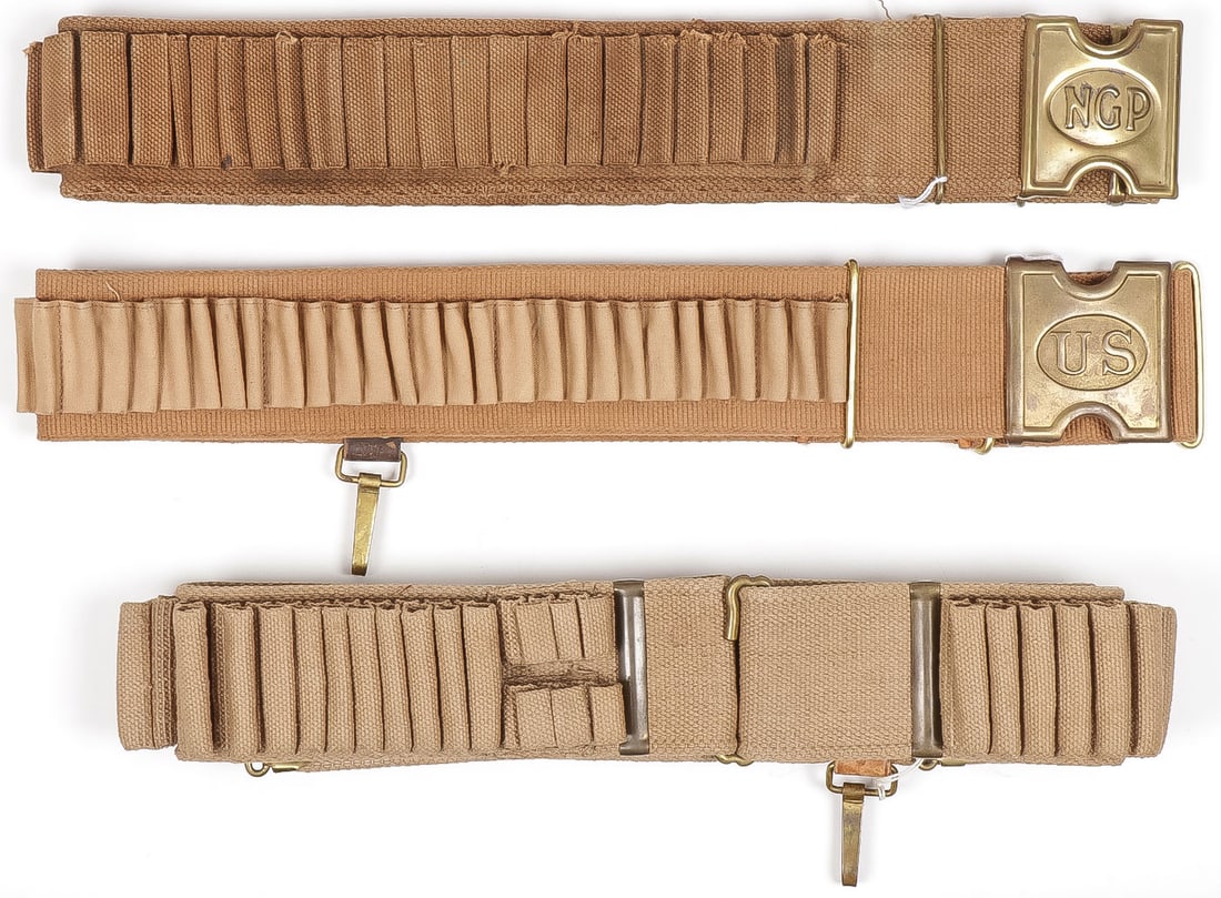 3 SPAN AM WEB CARTRIDGE BELTS: 3 SPAN AM WEB CARTRIDGE BELTS. Comprising a cotton web belt for the 45/70 with a Mills Pennsylvania National Guard buckle. Together with a Spaulding cavalry belt with hanger hook with possibly later U