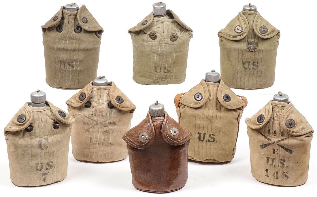 8 U.S. WWI CANTEENS AND COVERS: 8 U.S. WWI CANTEENS AND COVERS. Comprising a M1910 canteen dated 1918 (T.J.M.B.W. Co.) in a unique Rock Island Arsenal leather cover and hanger dated 1915, a M1903 canteen and cup, no makers marks or