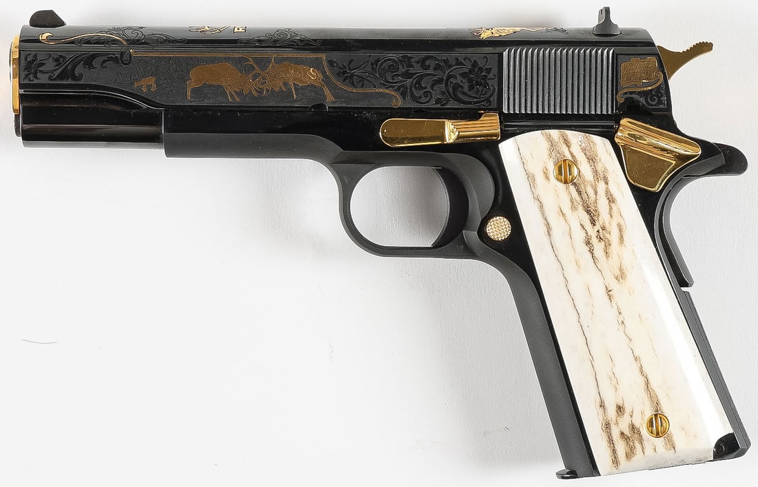 COLT .45 ACP COMMEMORATIVE PISTOL: COLT .45 ACP COMMEMORATIVE PISTOL. Comprising a Colt .45 Cal semi-automatic pistol. The slide heavily engraved and with gold inlaid elks and the top of slide with bull elk and RMEF (Rocky Mountain Elk