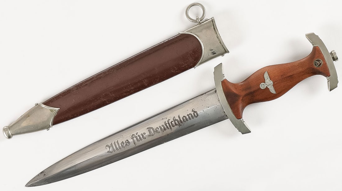 GOOD GERMAN WWII SA DAGGER: GOOD GERMAN WWII SA DAGGER. Of standard configuration, with wood inlaid grip, painted scabbard, and suspension loop. Standard clean engraved blade, "Alles fur Deutschland," and ricasso with maker mark