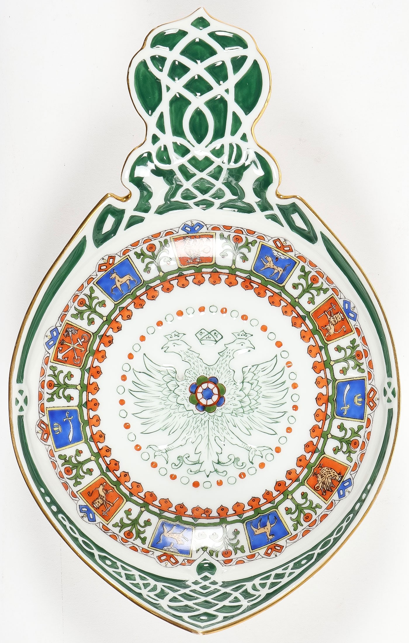 LARGE RUSSIAN PORCELAIN KOVSH, KORNILOV: LARGE RUSSIAN PORCELAIN KOVSH, KORNILOV. Comprising a large porcelain kovsh in the Pan-Slavic taste, Kornilov, circa 1900. On raised ring foot with raised prow and large flat scalloped handle. The cav