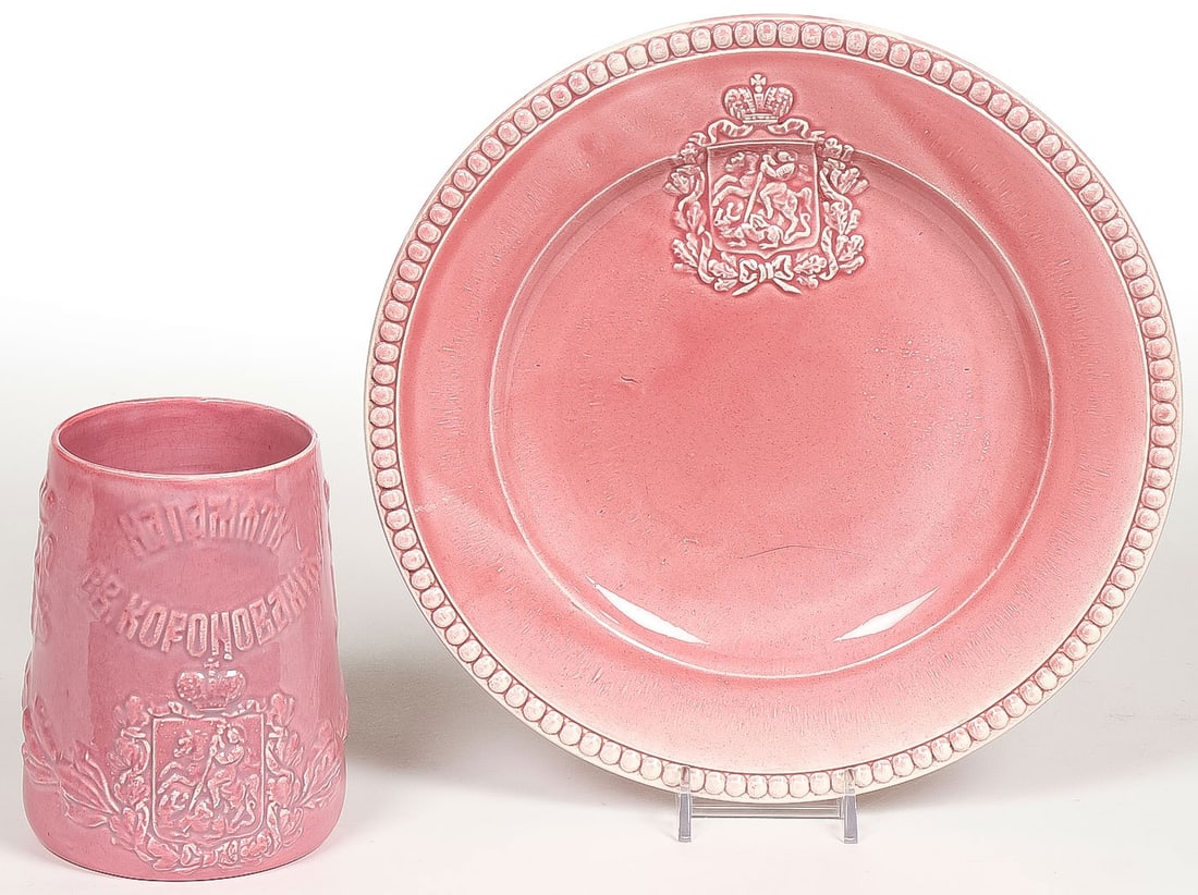 RUSSIAN KUZNETZOV NII CORONATION BEAKER & PLATE: RUSSIAN KUZNETZOV NII CORONATION BEAKER & UNDERPLATE, 1896. Comprising a rare matching set, both beaker and plate, of the Kuznetsov glazed ceramic Tsar Nicholas II coronation beaker and plate. The bea