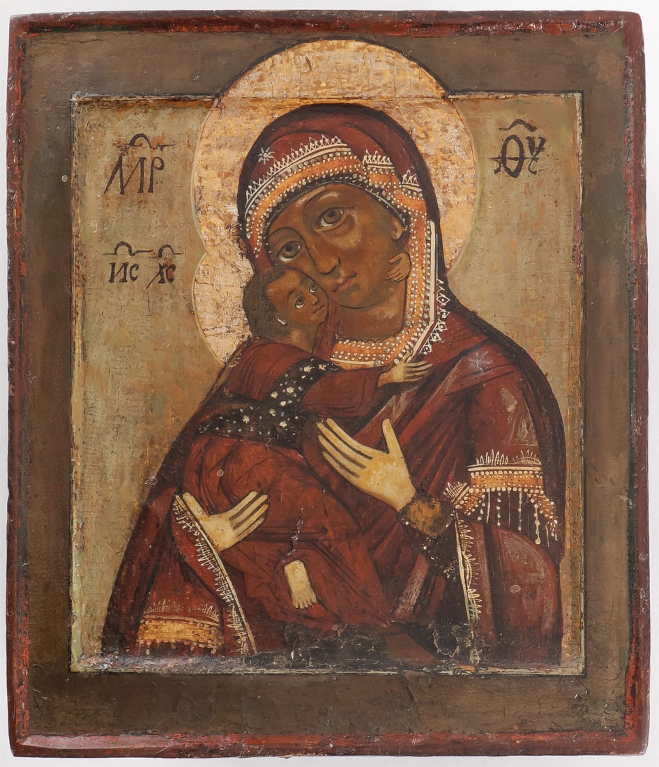 A 17TH CENTURY RUSSIAN ICON: A 17TH CENTURY RUSSIAN ICON. Comprising a good Russian icon of the Vladimir Mother of God C. 1680. Egg tempera on wood panel with double kovcheg rendered on a moss green ground with dark green borders