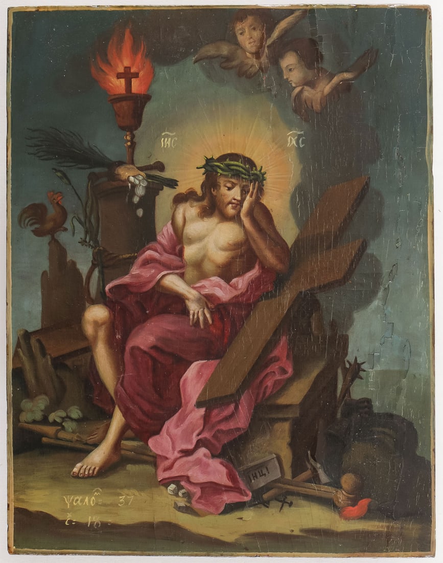 AN INTERESTING RUSSIAN ICON OF CHRIST, 19TH C: AN INTERESTING RUSSIAN ICON OF CHRIST, 19TH C. Comprising a unique icon of Christ seated and with crown of thorns surrounded by implements of the Passion and winged cherubs. The lower left corner insc