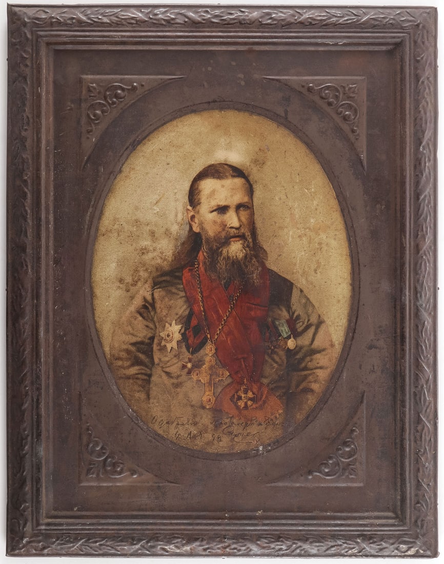 RARE RUSSIAN TIN LITHOGRAPH JOHN OF KRONSTADT: RARE RUSSIAN TIN LITHOGRAPH JOHN OF KRONSTADT, C. 1900. Comprising a rare surviving color lithograph on tin in integral frame depicting Father John of Kronstadt seated and wearing a variety of Imperia