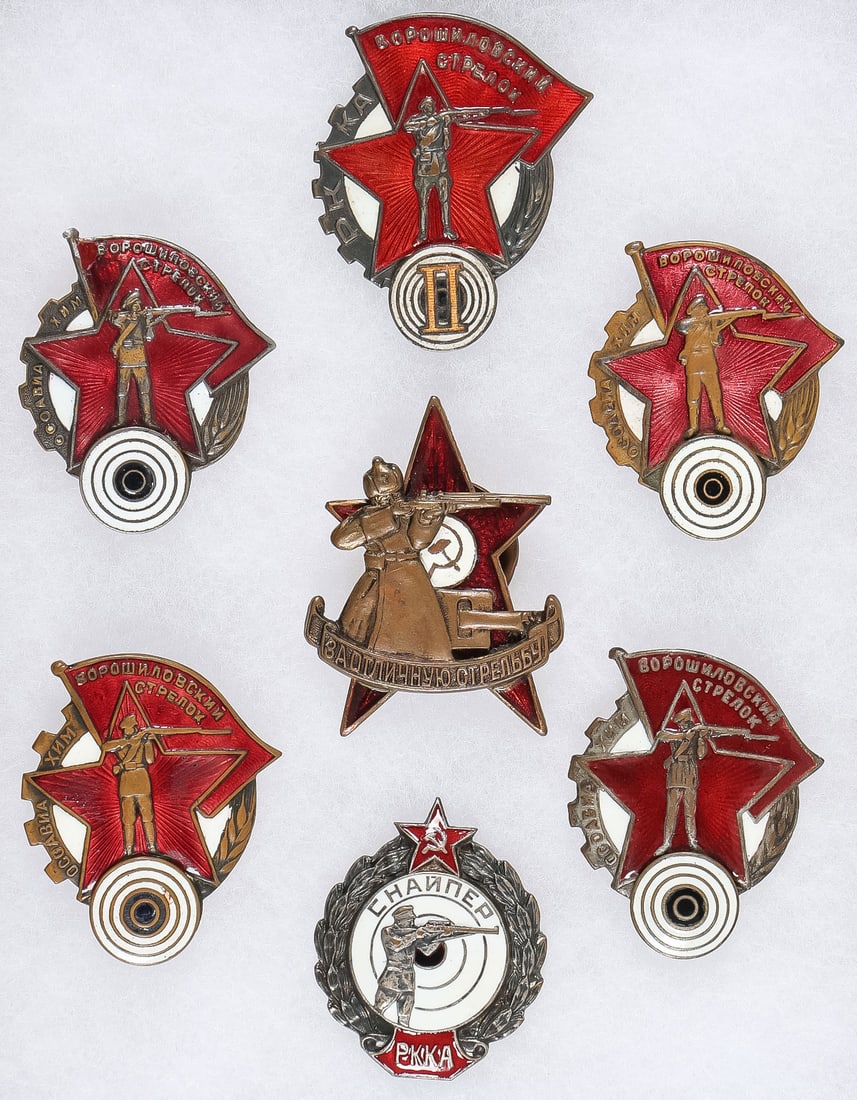7 EARLY SOVIET SHOOTING/MARKSMANSHIP BADGES: 7 EARLY SOVIET SHOOTING/MARKSMANSHIP BADGES. Comprising a good group of seven individual screw-back badges, including at top center a Voroshilov 2nd Grade Marksmanship badge stamped GUPVO on verso, to