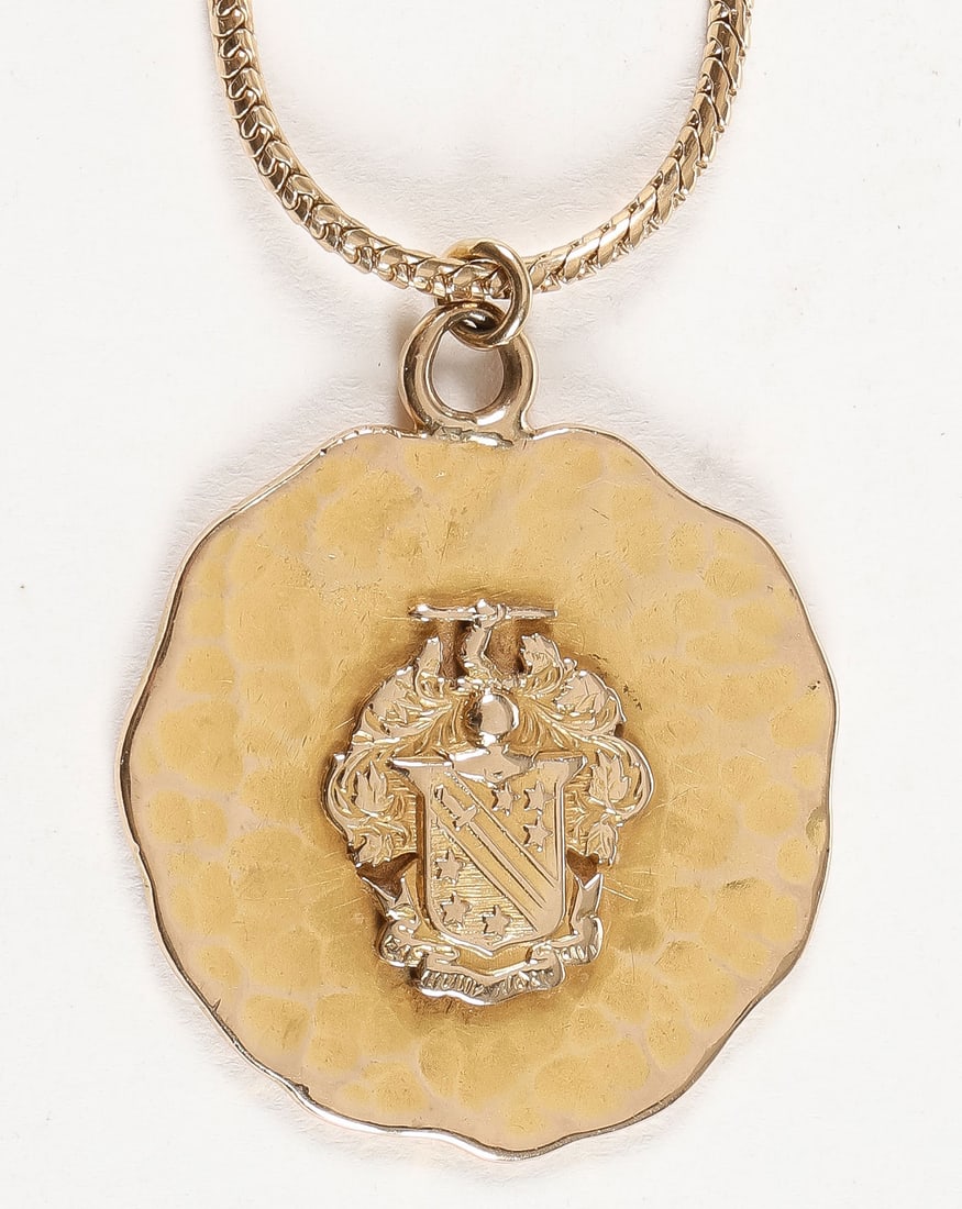 14K GOLD PENDANT AND CHAIN: 14K GOLD PENDANT AND CHAIN. Comprising a 14K gold Omega Psi Phi pendant on a 19-inch (48.26cm) 14K gold chain. Total weight 17 grams.SHIPPING NOTICE:If you are not using the Live Auctioneers Live Sh