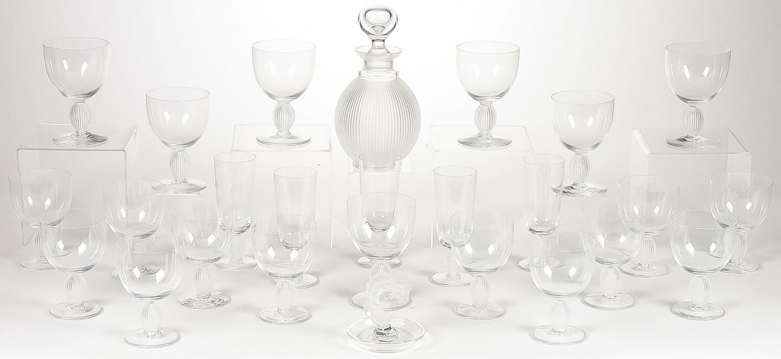 26 PIECES OF LALIQUE CRYSTAL: 26 PIECES OF LALIQUE CRYSTAL. Comprising 25 pieces of Lalique crystal Langeais stemware including 5 champagne flutes (6.5 inches), 12 water goblets (5.75 inches), 12 wine glasses (5.25 inches), and a