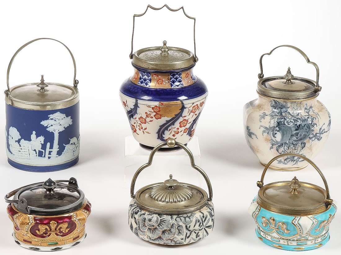 6 ENGLISH BISCUIT JARS: 6 ENGLISH BISCUIT JARS. Comprising a good variety of 6 vintage English biscuit jars as shown, including Wedgwood, Macintyre & Co., Royal Doulton, and Tunnicliffe & Co. Greatest height 7.5 inches.SHIPP