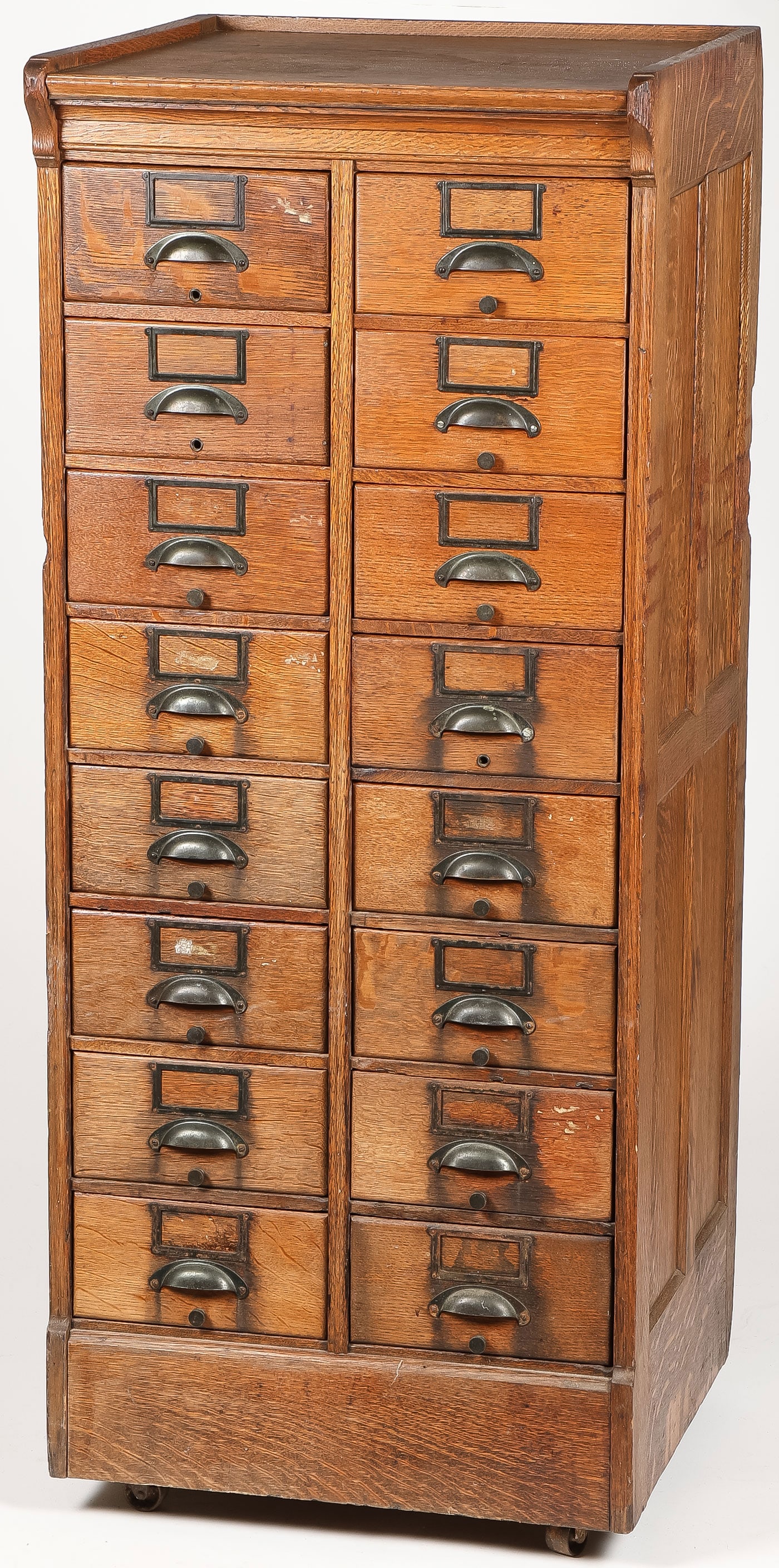 VINTAGE OAK CARD CABINET, C. 1900: VINTAGE OAK CARD CABINET, C. 1900. Total of 16 drawers, with paneled sides. Height 54.5 inches, depth 22 inches, width 22 inches. LOCAL PICK-UP OR 3RD PARTY SHIPPER ONLY.SHIPPING NOTICE:If you are n